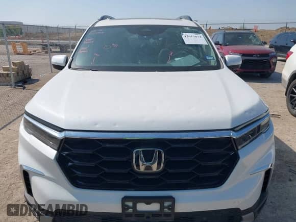 2023 Honda Pilot Touring с VIN 5FNYG2H77PB013738, выставлен на аукционе IAAI как лот 42013874 с пробегом 33 677 миль миль и . История ставок и продаж доступна на DreamBid. Изображение 12.
