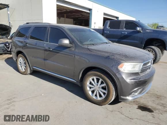 2015 Dodge Durango SXT with VIN 1C4RDHAG4FC938032, listed as a Copart auction lot 52642665 with 119,186 mi miles and Salvage title. Bid and sale history available at DreamBid. Image 4.
