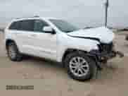 2016 Jeep Grand Cherokee Laredo with VIN 1C4RJEAGXGC415722, listed as a Copart auction lot 65428555 with 211,133 mi miles and Salvage title. Bid and sale history available at DreamBid. Image 4.