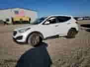 2016 Hyundai Santa Fe with VIN 5XYZTDLB4GG323250, listed as a Copart auction lot 86855355 with 77,930 mi miles and Salvage title. Bid and sale history available at DreamBid. Image 1.
