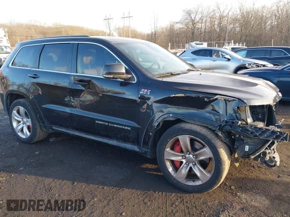2015 Jeep Grand Cherokee SRT with VIN 1C4RJFDJ6FC744087, listed as a IAAI auction lot 41500653 with 130,530 mi miles and . Bid and sale history available at DreamBid. Image 19.