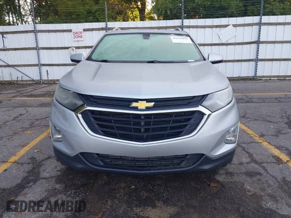 2018 Chevrolet Equinox LT z VIN 2GNAXSEV5J6246266, wystawiony jako IAAI lot #43139092 z przebiegiem 104 464 mil mil oraz . Historia ofert i sprzedaży dostępna na DreamBid. Obrazek 13.