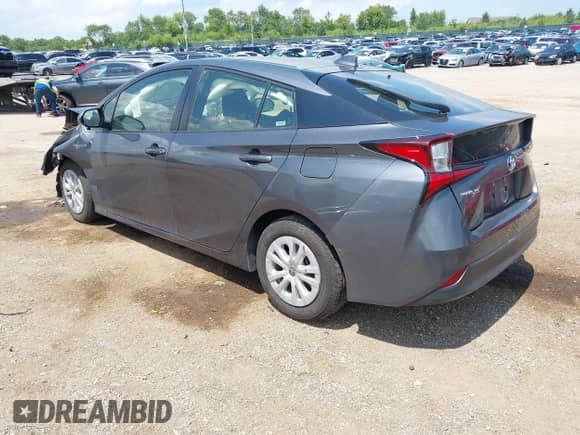 2022 Toyota Prius L Eco with VIN JTDKAMFU5N3160758, listed as a IAAI auction lot 42699871 with 64,403 mi miles and . Bid and sale history available at DreamBid. Image 3.