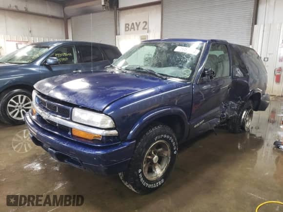 2005 Chevrolet Blazer z VIN 1GNCS18X65K101710, wystawiony jako Copart lot #76982844 z przebiegiem 129 988 mil mil oraz Szkoda całkowita • Salvage title. Historia ofert i sprzedaży dostępna na DreamBid. Obrazek 1.