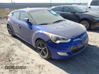 2013 Hyundai Veloster w/Black Int z VIN KMHTC6AD1DU095946, wystawiony jako IAAI lot #43497429 z przebiegiem 148 798 mil mil oraz . Historia ofert i sprzedaży dostępna na DreamBid. Obrazek 1.