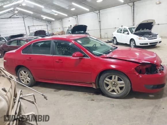 2011 Chevrolet Impala LT Retail with VIN 2G1WB5EK2B1257009, listed as a IAAI auction lot 43300655 with 206,861 mi miles and . Bid and sale history available at DreamBid. Image 14.