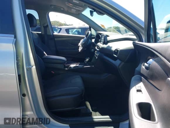 2019 Hyundai Santa Fe SE with VIN 5NMS23AD4KH100188, listed as a IAAI auction lot 43374582 with 88,759 mi miles and . Bid and sale history available at DreamBid. Image 5.