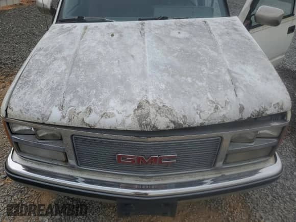 1989 GMC Sierra 1500 z VIN 1GTDC14K0KZ509336, wystawiony jako Copart lot #49060915 z przebiegiem 143 685 mil mil oraz Czysty tytuł • Clean title. Historia ofert i sprzedaży dostępna na DreamBid. Obrazek 11.