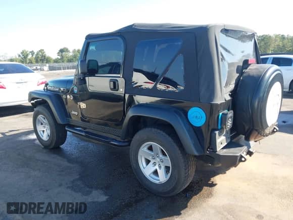2003 Jeep Wrangler Rubicon z VIN 1J4FA69S33P310695, wystawiony jako IAAI lot #43248843 z przebiegiem 97 024 mil mil oraz . Historia ofert i sprzedaży dostępna na DreamBid. Obrazek 3.