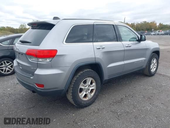2014 Jeep Grand Cherokee Laredo z VIN 1C4RJFAG0EC251156, wystawiony jako IAAI lot #43428557 z przebiegiem 175 570 mil mil oraz . Historia ofert i sprzedaży dostępna na DreamBid. Obrazek 4.