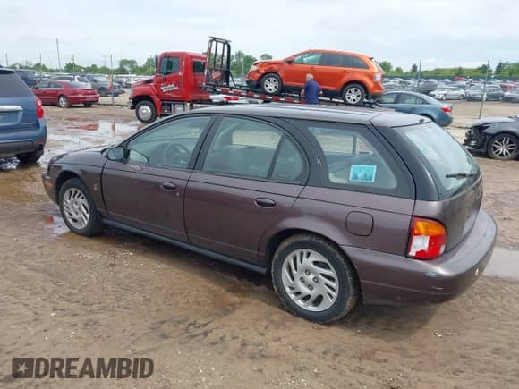 1998 Saturn SW with VIN 1G8ZK8279WZ233142, listed as a IAAI auction lot 42721203 with 114,853 mi miles and . Bid and sale history available at DreamBid. Image 3.