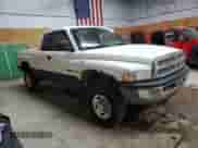 1999 Dodge 2500 with VIN 3B7KF23Z5XG126714, listed as a Copart auction lot 61977325 with 198,740 mi miles and Clean title. Bid and sale history available at DreamBid. Image 4.