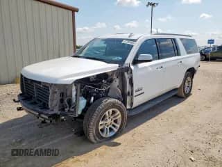 2019 Chevrolet Suburban LS with VIN 1GNSCGKC6KR210298, listed as a Copart auction lot 67282405 with 104,939 mi miles and Salvage title. Bid and sale history available at DreamBid. Image 1.