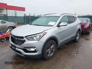 2018 Hyundai Santa Fe 2.4L z VIN 5XYZUDLB1JG554353, wystawiony jako IAAI lot #43426577 z przebiegiem 154 094 mil mil oraz . Historia ofert i sprzedaży dostępna na DreamBid. Obrazek 2.