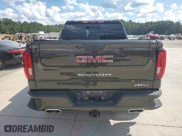 2023 GMC Sierra 1500 AT4 with VIN 1GTUUEEL0PZ315022, listed as a Copart auction lot 82069025 with 59,241 mi miles and Salvage title. Bid and sale history available at DreamBid. Image 6.