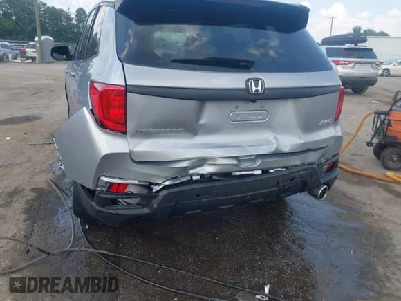 2022 Honda Passport EX-L with VIN 5FNYF8H5XNB021611, listed as a IAAI auction lot 42876732 with 29,265 mi miles and . Bid and sale history available at DreamBid. Image 6.
