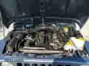 1998 Jeep Wrangler Sport z VIN 1J4FY19S5WP798597, wystawiony jako Copart lot #68707305 z przebiegiem Nie podano mil oraz Szkoda całkowita • Salvage title. Historia ofert i sprzedaży dostępna na DreamBid. Obrazek 11.