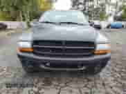 2003 Dodge Dakota Sport с VIN 1D7HL38N63S192308, выставлен на аукционе Copart как лот 77494684 с пробегом 128 512 миль миль и Списание • Salvage title. История ставок и продаж доступна на DreamBid. Изображение 5.