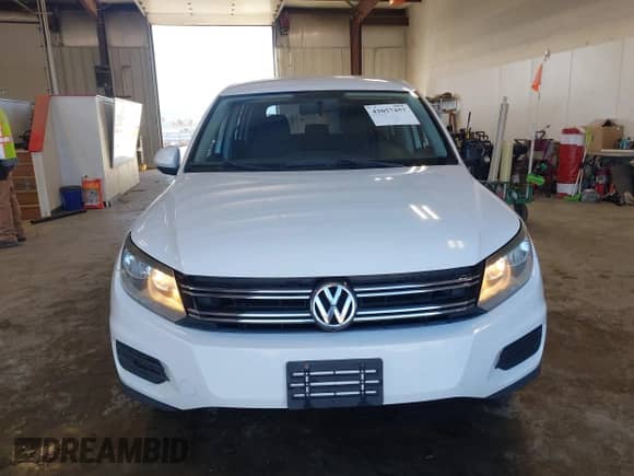 2013 Volkswagen Tiguan with VIN WVGCV3AX7DW605594, listed as a IAAI auction lot 42057457 with 131,629 mi miles and . Bid and sale history available at DreamBid. Image 12.