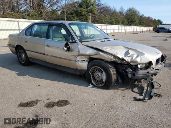 1997 BMW 7 Series 740iL with VIN WBAGJ8325VDM04352, listed as a Copart auction lot 70189534 with 129,463 mi miles and Salvage title. Bid and sale history available at DreamBid. Image 4.
