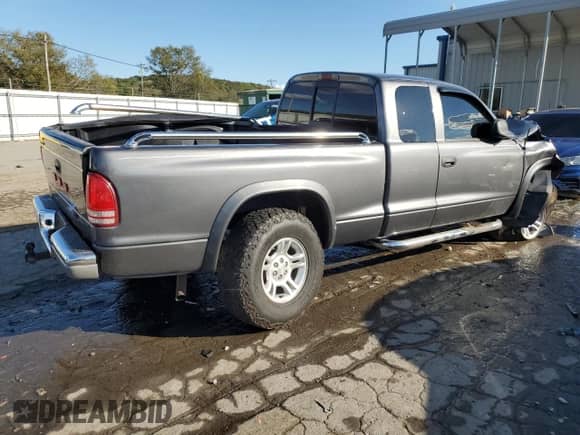 2003 Dodge Dakota SLT z VIN 1D7HG42N93S363166, wystawiony jako Copart lot #72176534 z przebiegiem 189 834 mil mil oraz Szkoda całkowita • Salvage title. Historia ofert i sprzedaży dostępna na DreamBid. Obrazek 3.