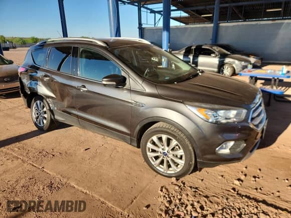 2017 Ford Escape Titanium with VIN 1FMCU9J9XHUC51563, listed as a Copart auction lot 81632235 with 52,259 mi miles and Salvage title. Bid and sale history available at DreamBid. Image 4.