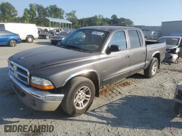 2001 Dodge Dakota Sport with VIN 1B7HL2AX91S334986, listed as a Copart auction lot 61963115 with 261,289 mi miles and Salvage title. Bid and sale history available at DreamBid. Image 1.