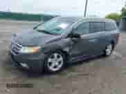 2012 Honda Odyssey Touring z VIN 5FNRL5H95CB132398, wystawiony jako IAAI lot #42789552 z przebiegiem 169 861 mil mil oraz . Historia ofert i sprzedaży dostępna na DreamBid. Obrazek 17.