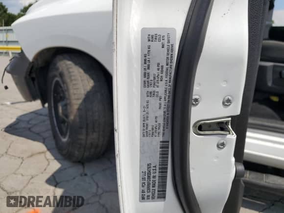 2021 Ram 1500 Tradesman z VIN 1C6RR6FG8MS547975, wystawiony jako Copart lot #69693145 z przebiegiem 50 558 mil mil oraz Szkoda całkowita • Salvage title. Historia ofert i sprzedaży dostępna na DreamBid. Obrazek 13.