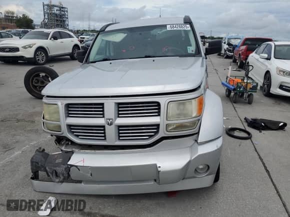 2011 Dodge Nitro SXT с VIN 1D4PT5GK8BW561396, выставлен на аукционе Copart как лот 68428825 с пробегом 103 103 миль миль и Списание • Salvage title. История ставок и продаж доступна на DreamBid. Изображение 5.