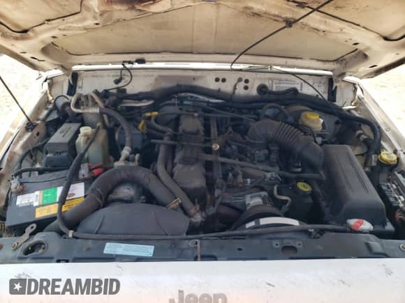 2001 Jeep Grand Cherokee с VIN 1J4FT47S21L596528, выставлен на аукционе Copart как лот 68641764 с пробегом Не указан миль и Списание • Salvage title. История ставок и продаж доступна на DreamBid. Изображение 12.