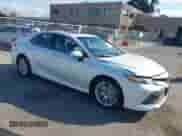 2020 Toyota Camry Hybrid XLE with VIN 4T1F31AK4LU523702, listed as a IAAI auction lot 42734831 with 144,778 mi miles and . Bid and sale history available at DreamBid. Image 1.