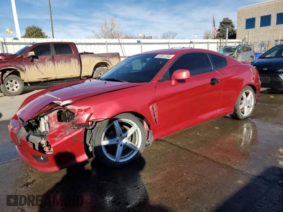 2006 Hyundai Tiburon GT z VIN KMHHN65F16U207031, wystawiony jako Copart lot #83851394 z przebiegiem 119 625 mil mil oraz Szkoda całkowita • Salvage title. Historia ofert i sprzedaży dostępna na DreamBid. Obrazek 1.