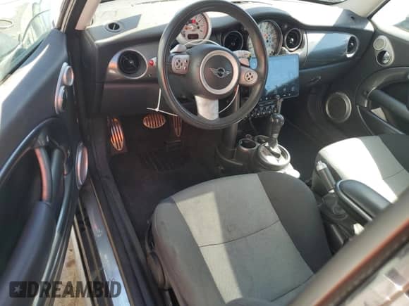 2006 MINI Hardtop S with VIN WMWRE33586TJ37385, listed as a Copart auction lot 67606184 with 78,671 mi miles and Salvage title. Bid and sale history available at DreamBid. Image 8.
