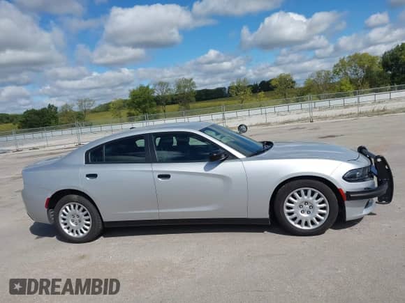 2020 Dodge Charger Police z VIN 2C3CDXKTXLH124217, wystawiony jako IAAI lot #43154620 z przebiegiem 119 464 mil mil oraz . Historia ofert i sprzedaży dostępna na DreamBid. Obrazek 13.