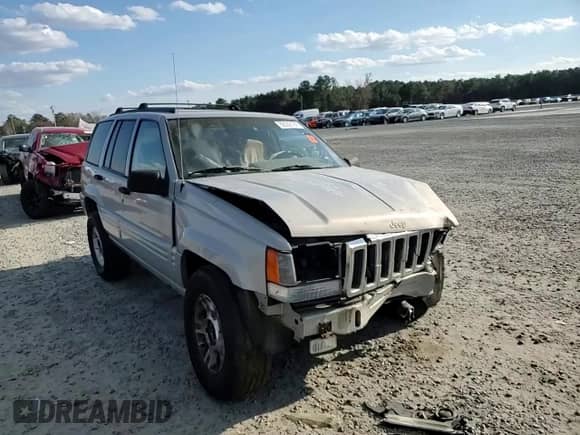1998 Jeep Grand Cherokee with VIN 1J4GX48Y7WC216585, listed as a Copart auction lot 83532184 with 144,739 mi miles and Salvage title. Bid and sale history available at DreamBid. Image 11.