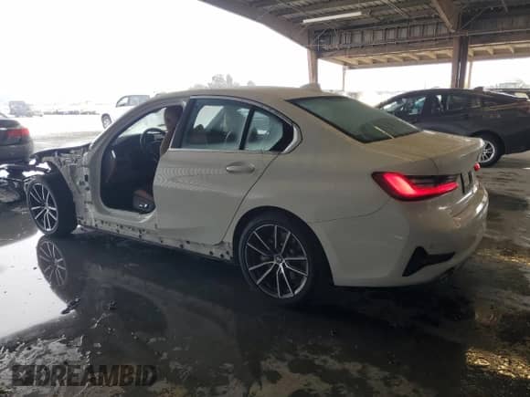 2019 BMW 3 Series 330i with VIN WBA5R1C54KAK12564, listed as a Copart auction lot 87452615 with 49,169 mi miles and Salvage title. Bid and sale history available at DreamBid. Image 2.