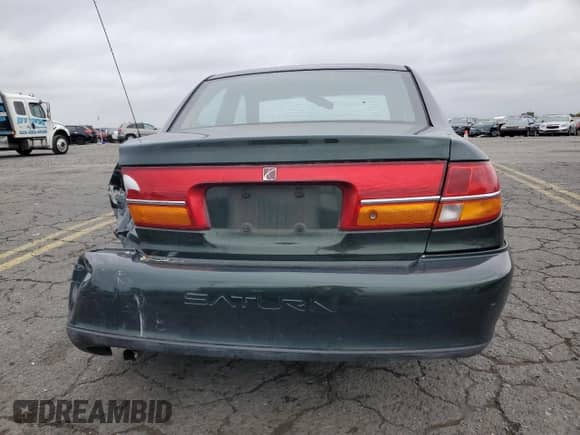 2001 Saturn LS with VIN 1G8JU54F41Y581083, listed as a Copart auction lot 73123714 with 98,500 mi miles and Salvage title. Bid and sale history available at DreamBid. Image 6.