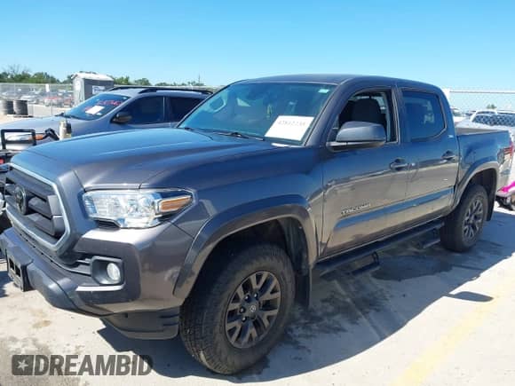 2021 Toyota Tacoma SR5 with VIN 5TFAZ5CN0MX106119, listed as a IAAI auction lot 42812735 with 70,968 mi miles and . Bid and sale history available at DreamBid. Image 2.