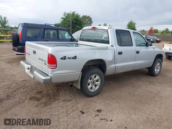 2003 Dodge Dakota with VIN 1D7HG48X23S228927, listed as a IAAI auction lot 43178638 with 150,136 mi miles and . Bid and sale history available at DreamBid. Image 4.