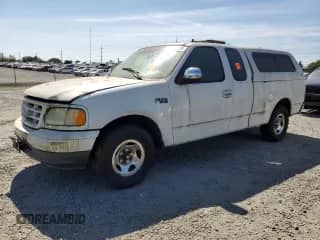 2002 Ford F-150 XL with VIN 1FTRX17242NA42385, listed as a Copart auction lot 81515565 with 694,327 mi miles and Salvage title. Bid and sale history available at DreamBid. Image 1.