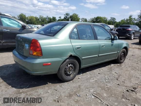 2005 Hyundai Accent GLS z VIN KMHCG45C35U622963, wystawiony jako Copart lot #68292114 z przebiegiem 137 655 mil mil oraz Szkoda całkowita • Salvage title. Historia ofert i sprzedaży dostępna na DreamBid. Obrazek 3.