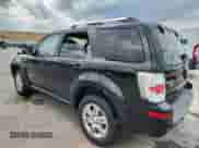 2008 Mercury Mariner Premier with VIN 4M2CU97108KJ12909, listed as a Copart auction lot 70864465 with 128,018 mi miles and Salvage title. Bid and sale history available at DreamBid. Image 2.