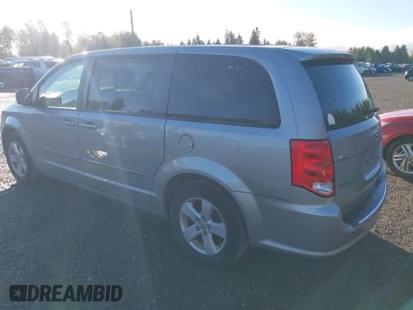 2013 Dodge Grand Caravan SE with VIN 2C4RDGBG6DR703399, listed as a IAAI auction lot 43230305 with 113,048 mi miles and . Bid and sale history available at DreamBid. Image 3.