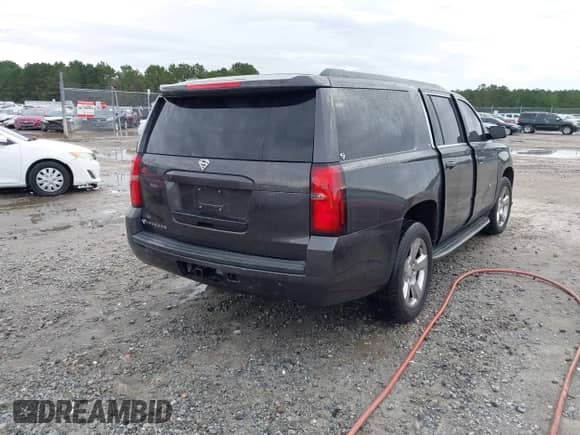 2015 Chevrolet Suburban LT with VIN 1GNSKJKC4FR226103, listed as a IAAI auction lot 43371366 with 234,764 mi miles and . Bid and sale history available at DreamBid. Image 4.