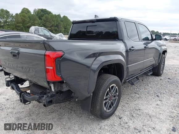 2024 Toyota Tacoma TRD Off Road with VIN 3TMLB5JN9RM060836, listed as a IAAI auction lot 43181595 with 21,563 mi miles and . Bid and sale history available at DreamBid. Image 4.