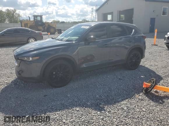 2023 Mazda CX-5 S Carbon Edition z VIN JM3KFBCM7P0169757, wystawiony jako Copart lot #70624645 z przebiegiem 31 275 mil mil oraz Szkoda całkowita • Salvage title. Historia ofert i sprzedaży dostępna na DreamBid. Obrazek 1.