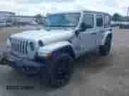 2023 Jeep Wrangler Sahara with VIN 1C4JJXP69PW695915, listed as a IAAI auction lot 42662028 with 36,957 mi miles and . Bid and sale history available at DreamBid. Image 2.