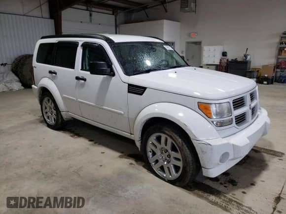 2011 Dodge Nitro Heat with VIN 1D4PU4GX7BW607335, listed as a Copart auction lot 59881235 with 152,891 mi miles and Salvage title. Bid and sale history available at DreamBid. Image 4.