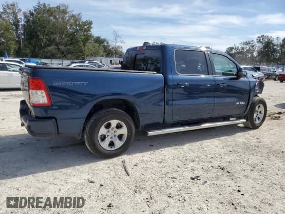 2023 Ram 1500 Big Horn with VIN 1C6SRFMT7PN556509, listed as a Copart auction lot 42938185 with 18,049 mi miles and Salvage title. Bid and sale history available at DreamBid. Image 3.